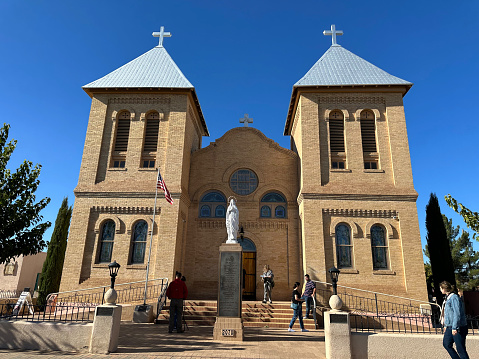 Mesilla, USA - November 13, 2022. Tourists outside Basilica of San Albino in downtown Mesilla, New Mexico, USA
