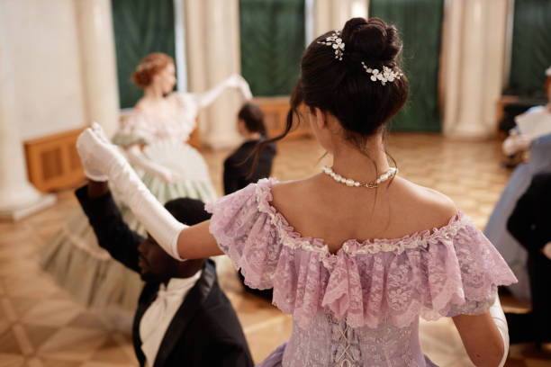 istock Back View Lady Wearing Ballgown Dancing with Gentleman 1854868802
