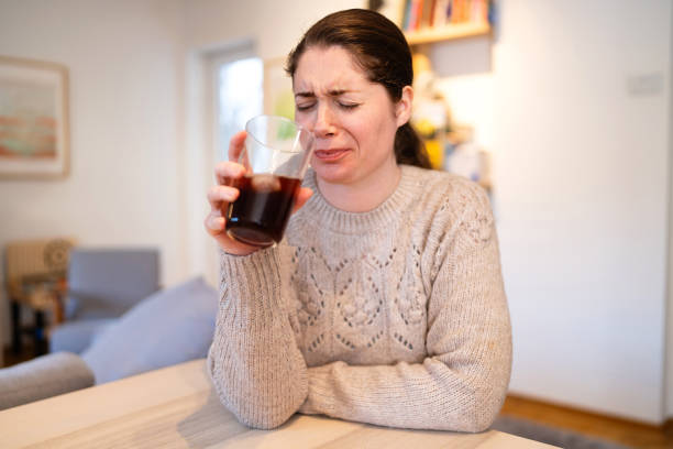 istock Caucasian woman with toothache making a grimace after she drinks a cold soda 1854868821