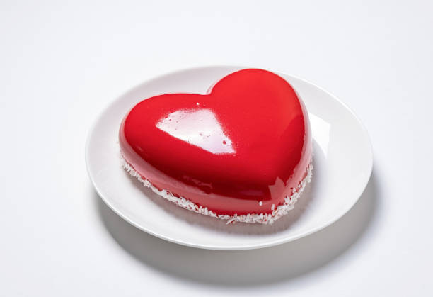 istock heart shaped glazed valentine cake on white plate on white background 1854872017