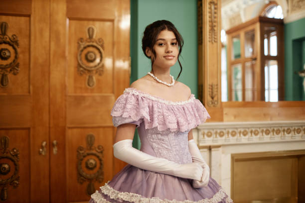 istock Young lady wearing pink ballgown 1854872032