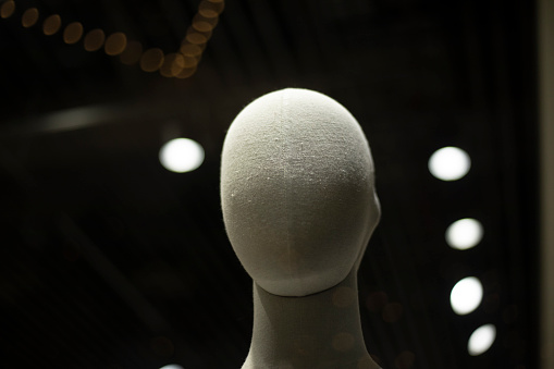 Mannequin head. Fabric mannequin. Figure of a man made of fabric. Face without details.