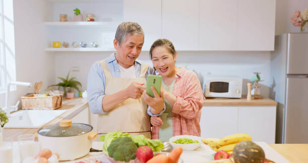 istock Asian elderly couple in kitchen 1854899159