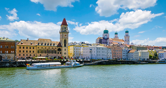Sightseeing tour of the famous city of Passau. View across the Danube to the passenger harbour, the old town with the town hall and Passau Cathedral (Stephen's Cathedral).