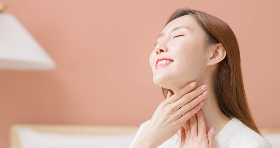 Closeup of asian female skincare neck in autumn and winter feel happily comfortable