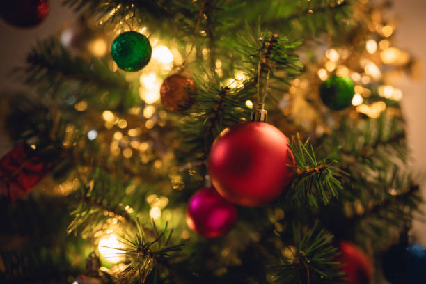 istock Close up decoration Christmas tree on lighting bokeh background, wallpaper, canvas for advertising.  Copy space of bokeh garlands in the background. New Year concept. 1854927963