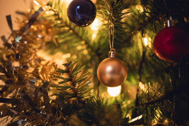 istock Close up decoration Christmas tree on lighting bokeh background, wallpaper, canvas for advertising.  Copy space of bokeh garlands in the background. New Year concept. 1854927978