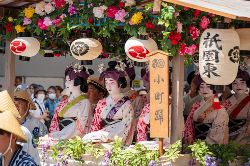 Kyoto, Japan - July 24 2023 : Gion Matsuri Festival, Hanagasa Junko Parade. Flower Umbrella Procession of float parade on the city street.