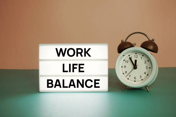 istock Work Life Balance text message on paper card with wooden easel and alarm clock 1854955749