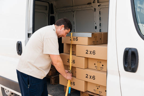 man securing packages with eggs - eggs animal egg stack stacking imagens e fotografias de stock