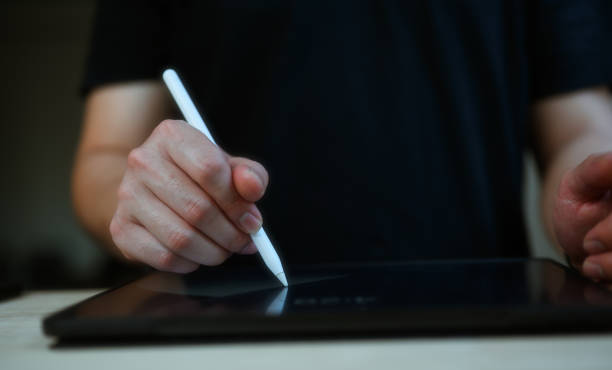 istock businessman hand using stylus pen working signing on digital tablet, Paperless workplace idea, e-signing, electronic signature 1854981864