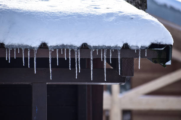 istock Ice and snow on the roof 1854988338