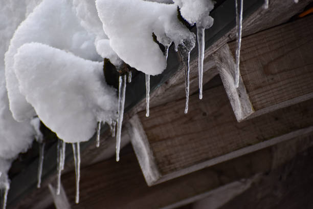 istock Ice and snow on the roof 1854989924
