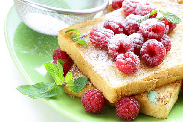 fresh toasted toast with raspberries and powdered sugar