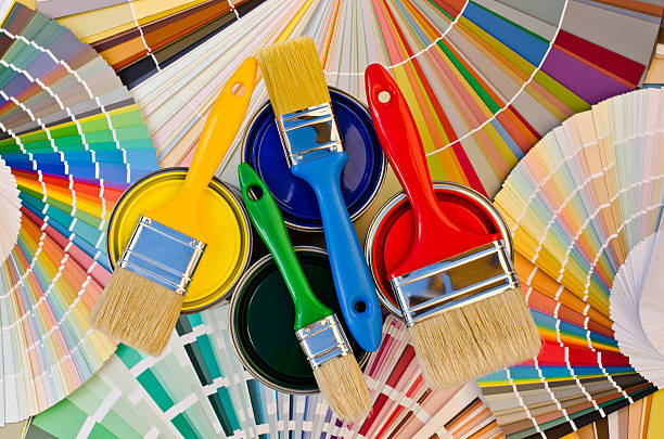 istock Paint cans and brushes on stripes of color sample. 185501083