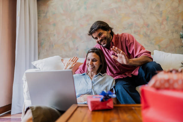 istock Couple on a video call using laptop at home 1855010899