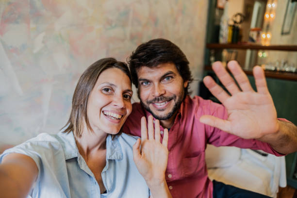 istock Couple on a video call at home - camera point of view 1855012001