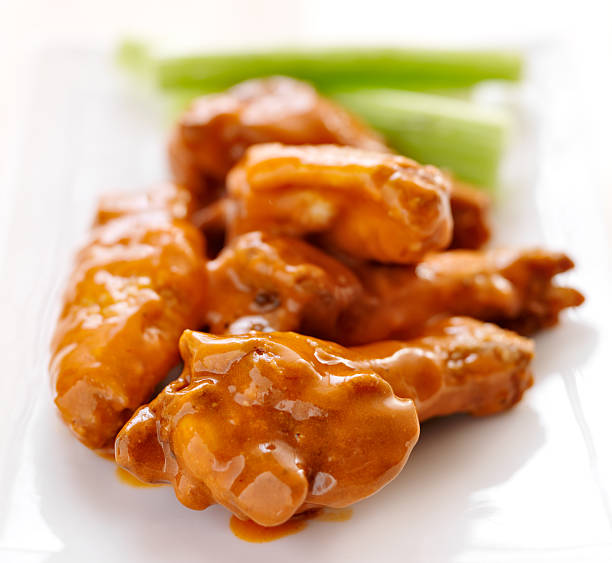 istock plate of buffalo wings with celery. 185501355