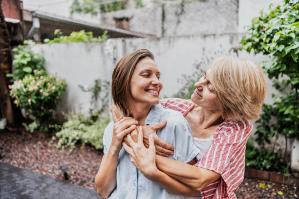 istock Mother and daughter embracing in the backyard 1855014783