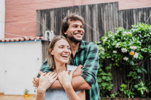 Couple embracing in the backyard