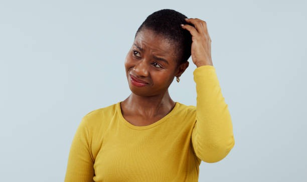 istock Confused, thinking and black woman scratching head in  studio with why, brainstorming or solution on grey background. Questions, doubt and model with emoji gesture for problem solving, how or forget 1855019175