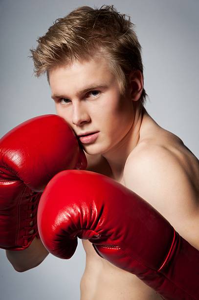 istock man with boxing red gloves 185502071