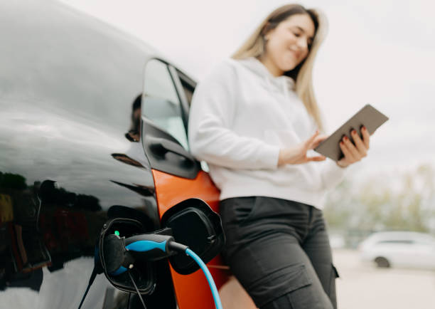 istock Electric vehicle charging at the charging station 1855022393