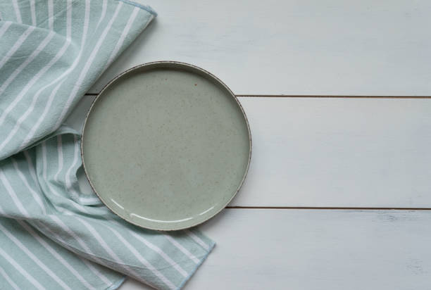 istock Empty plate and napkin on wooden 1855036185