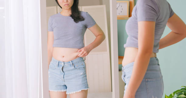 istock woman dissatisfied about body shape 1855039870