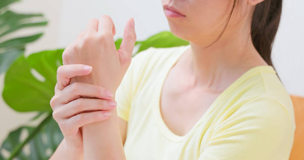 istock woman twist uncomfortable wrist 1855041518