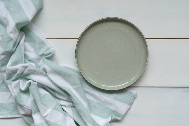istock Empty plate and napkin on wooden 1855042043