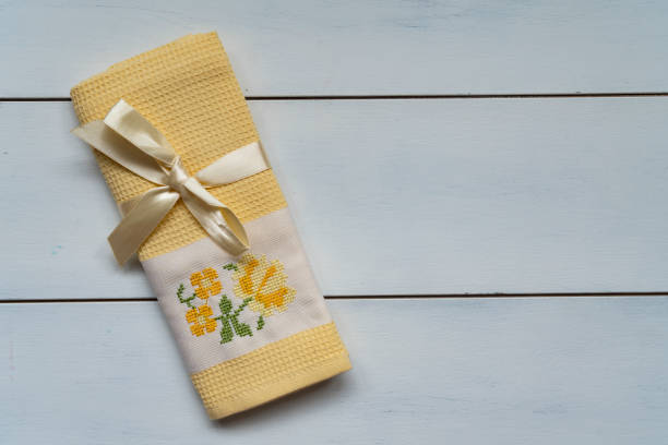 Embroidery linen napkin on the old wooden table