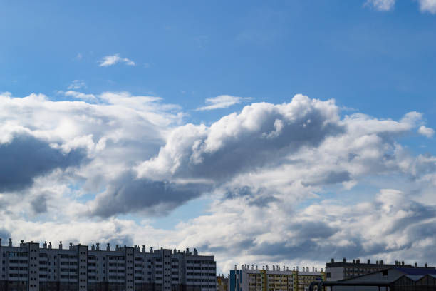 istock Cumulus clouds in the blue sky over multi-storey buildings 1855044732