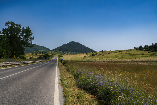 Idyllic Greek landscape next to the road. Panoramic view from a motor home.