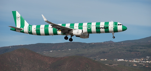 Tenerife, Spain December 10st, 2023. Airbus A321-211 Condor Airlines flies in the blue sky. Landing at Tenerife Airport