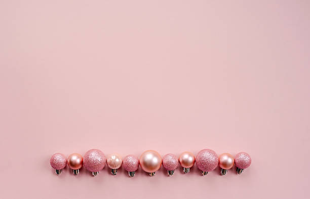 istock Christmas composition. Christmas pink decorations on pastel pink background. Flat lay, top view, copy space 1855053312