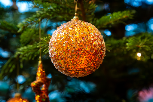 Christmas ball on shiny background.