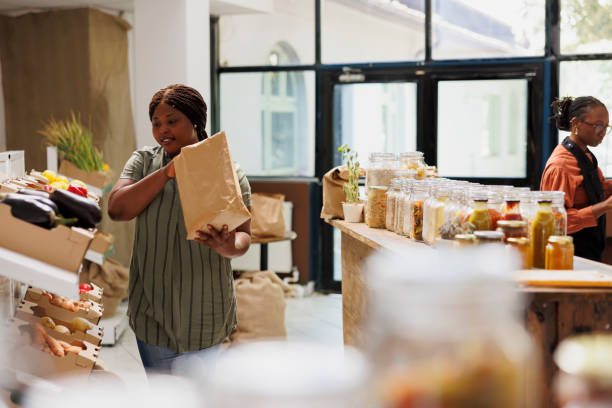 istock Woman browsing produce section in store 1855064572