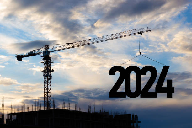 istock Construction crane raises 2024 new year 1855084387
