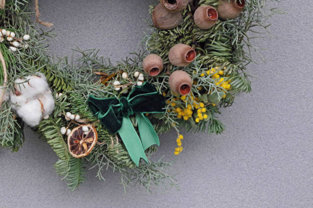 istock handmade Christmas wreath on grey background 1855088107