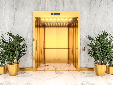 3d render image of a gold lift with light marble walls