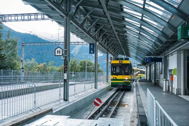 istock Train is coming on railway to station in Switzerland 1855116013