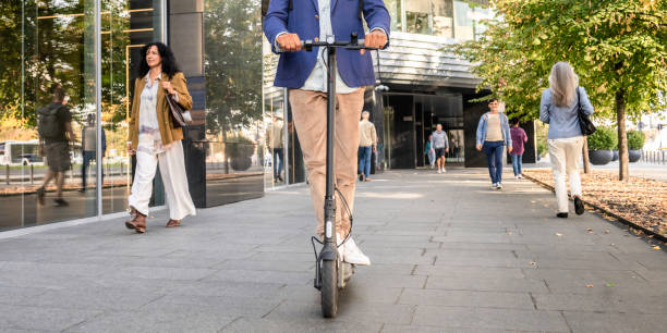 istock Man riding electric scooter, low section 1855125491