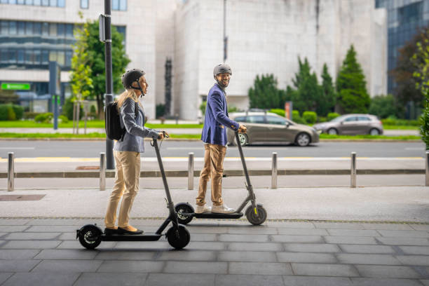 istock Smiling couple riding electric scooter 1855125498