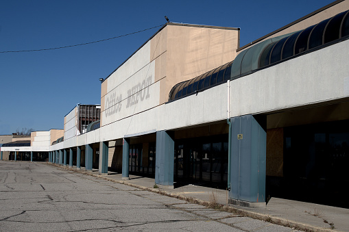 Exterior façade of the former Salem Consumer Square shopping center in Trotwood, Ohio now abandoned and decaying after years of neglect.