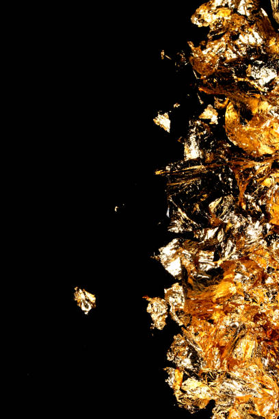istock Gold Leaf Pieces Close Up on A Black Background as Decorative Pieces 1855180263