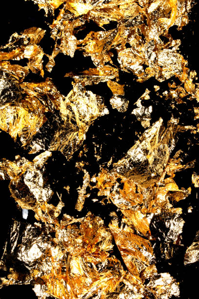 istock Gold Leaf Pieces Close Up on A Black Background as Decorative Pieces 1855181379