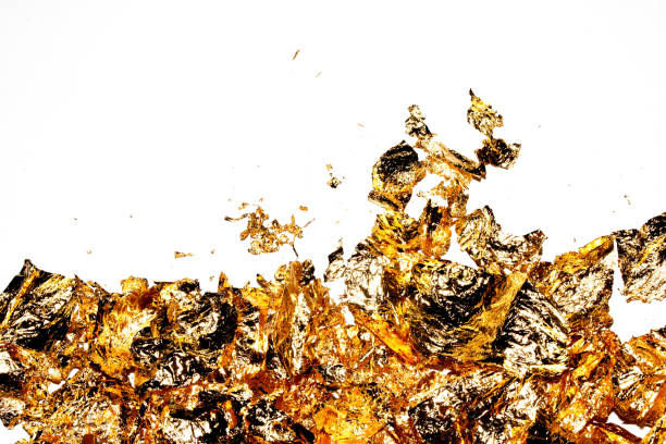 istock Gold Leaf Pieces Close Up on A White Background as Decorative Pieces 1855182979