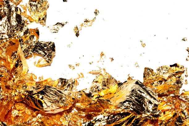 istock Gold Leaf Pieces Close Up on A White Background as Decorative Pieces 1855185157