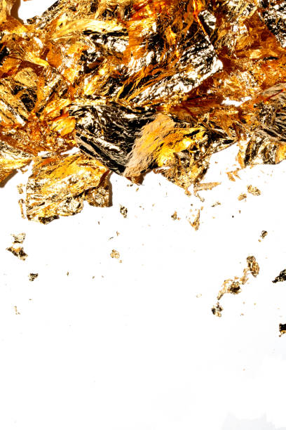 istock Gold Leaf Pieces Close Up on A White Background as Decorative Pieces 1855185158